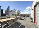 Rooftop deck with seating and dining table providing a perfect setting for outdoor entertainment at 3814 Zenobia St, Denver, CO 80212