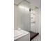 The bathroom features a glass-enclosed shower, tiled walls, and modern fixtures at 2518 N Washington St, Denver, CO 80205