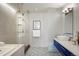 Modern bathroom with large glass shower, sleek vanity, vessel sink, and stylish tile floor at 2518 N Washington St, Denver, CO 80205