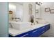 Bright bathroom features a dual vanity with vessel sinks, stylish fixtures, and patterned tile floor at 2518 N Washington St, Denver, CO 80205
