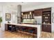 Modern kitchen featuring stainless steel appliances, sleek countertops, and rich wood cabinetry at 2518 N Washington St, Denver, CO 80205