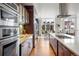 Spacious kitchen with a large island, modern appliances, and a seamless flow to the dining area at 2518 N Washington St, Denver, CO 80205