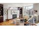 Bright living room boasts a modern fireplace, large windows, and stylish furnishings, creating an inviting and sophisticated space at 2518 N Washington St, Denver, CO 80205