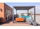 Inviting rooftop deck featuring a pergola, stylish seating, and string lights perfect for outdoor enjoyment at 2518 N Washington St, Denver, CO 80205