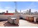 Rooftop deck with outdoor dining area, city views, and ample space for entertaining at 2518 N Washington St, Denver, CO 80205