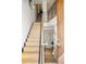 Grand staircase featuring wooden steps, a contemporary railing, and abundant natural light at 2518 N Washington St, Denver, CO 80205