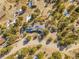 Stunning aerial view of a home with solar panels surrounded by lush trees at 312 Meadow View Dr, Evergreen, CO 80439