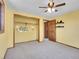 Bedroom featuring light yellow walls, carpeted floor and wooden closet with shelves at 312 Meadow View Dr, Evergreen, CO 80439