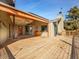 A spacious deck features wood burning stove and open views, perfect for outdoor gatherings at 312 Meadow View Dr, Evergreen, CO 80439