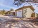 A charming home boasting a large garage and situated in a serene, wooded environment at 312 Meadow View Dr, Evergreen, CO 80439