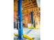Spacious garage featuring a two-post car lift, ideal for car enthusiasts and home mechanics at 312 Meadow View Dr, Evergreen, CO 80439