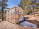 Backyard greenhouse for cultivating plants and enjoying the outdoors year-round at 312 Meadow View Dr, Evergreen, CO 80439