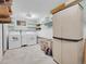 Spacious laundry room with modern washer, dryer, and ample storage at 312 Meadow View Dr, Evergreen, CO 80439