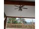 Covered porch with ceiling fan and stunning views of the surrounding landscape at 312 Meadow View Dr, Evergreen, CO 80439