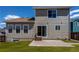 Back exterior featuring vinyl siding, a patio, and backyard access through sliding glass doors at 5549 Helena St, Denver, CO 80239