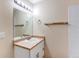 Bathroom featuring a shower and tub combination, vanity with solid surface countertop, lighting, and mirror at 5549 Helena St, Denver, CO 80239