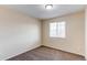 Bedroom featuring a window, neutral paint, and carpet at 5549 Helena St, Denver, CO 80239