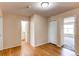 Bedroom featuring wood floors, two closets, and an ensuite bathroom entrance at 5549 Helena St, Denver, CO 80239