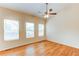 Bedroom featuring wood-look floors, neutral walls and multiple windows for plenty of natural light at 5549 Helena St, Denver, CO 80239