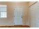 A light and bright entryway features wood-look floors, a coat closet, and a window for natural light at 5549 Helena St, Denver, CO 80239