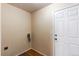 Laundry room featuring hookups and a door at 5549 Helena St, Denver, CO 80239
