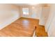 Spacious and bright living area with hardwood flooring and ample natural light at 5549 Helena St, Denver, CO 80239