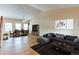 Bright living room with vaulted ceilings and a combined dining area, perfect for entertaining guests at 5549 Helena St, Denver, CO 80239