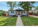 Charming home featuring a well-manicured lawn and inviting walkway at 2080 Fulton St, Aurora, CO 80010