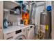 Functional laundry room with modern washer/dryer and ample storage shelving at 2080 Fulton St, Aurora, CO 80010