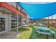 Charming outdoor patio with picnic tables offers a delightful space to relax and enjoy the fresh air at 2080 Fulton St, Aurora, CO 80010