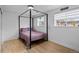 Comfortable bedroom with a modern bed frame, and a large window providing great natural light at 690 S Newark Ct, Aurora, CO 80012