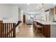 Spacious entryway with kitchen island and staircase leading to the home's upper level at 690 S Newark Ct, Aurora, CO 80012