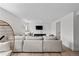 Spacious living room with modern lighting and comfortable seating, perfect for relaxing and entertaining at 690 S Newark Ct, Aurora, CO 80012