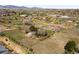 Panoramic aerial view of a house in a rural neighborhood with mountain views at 12940 W 75Th Ave, Arvada, CO 80005