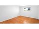 Bright bedroom featuring hardwood floors and a window providing natural light at 12940 W 75Th Ave, Arvada, CO 80005