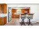 Spacious kitchen with stainless steel appliances, ample counter space and bar seating at 12940 W 75Th Ave, Arvada, CO 80005