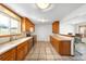 Well-lit kitchen with ample counter space, stainless steel appliances, and a convenient layout for cooking and entertaining at 12940 W 75Th Ave, Arvada, CO 80005