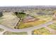 Aerial view of property boundary that includes a house, white fenced horse arena and outbuilding at 12940 W 75Th Ave, Arvada, CO 80005