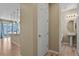 Hallway leading to a kitchen and bathroom with hardwood floors at 6404 Dry Fork Dr, Frederick, CO 80516