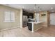 Kitchen with an island, stainless steel appliances, and hardwood floors at 6404 Dry Fork Dr, Frederick, CO 80516