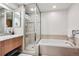 Bathroom showcasing a shower, and a bathtub. The neutral color scheme creates a relaxing and clean aesthetic at 1401 Wewatta St # 911, Denver, CO 80202