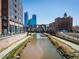 Scenic shot of the city showcasing the bridge, skyline, and waterway at 1401 Wewatta St # 911, Denver, CO 80202