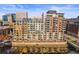 Multi-story condominium building featuring balconies overlooking the river with city views at 1401 Wewatta St # 911, Denver, CO 80202