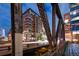 Contemporary multi-story building with private balconies framed by the city bridge at 1401 Wewatta St # 911, Denver, CO 80202