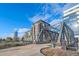 Apartment building with modern architectural design, adjacent to bridge creating an urban landscape with vibrant city views at 1401 Wewatta St # 911, Denver, CO 80202