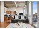 Bright and open living space with concrete ceilings and floor-to-ceiling windows allowing lots of natural light at 1401 Wewatta St # 911, Denver, CO 80202