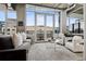 Bright living room with balcony access and comfortable seating at 1401 Wewatta St # 911, Denver, CO 80202