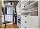 Organized walk-in closet features built-in shelving, drawers, and ample storage for clothes and accessories at 1401 Wewatta St # 911, Denver, CO 80202