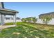 Spacious backyard with healthy lawn, privacy fence, and young landscaping at 523 Beckwourth Ave, Fort Lupton, CO 80621