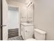 A half bathroom featuring patterned floors, a vanity with a single sink, and medicine cabinet at 523 Beckwourth Ave, Fort Lupton, CO 80621